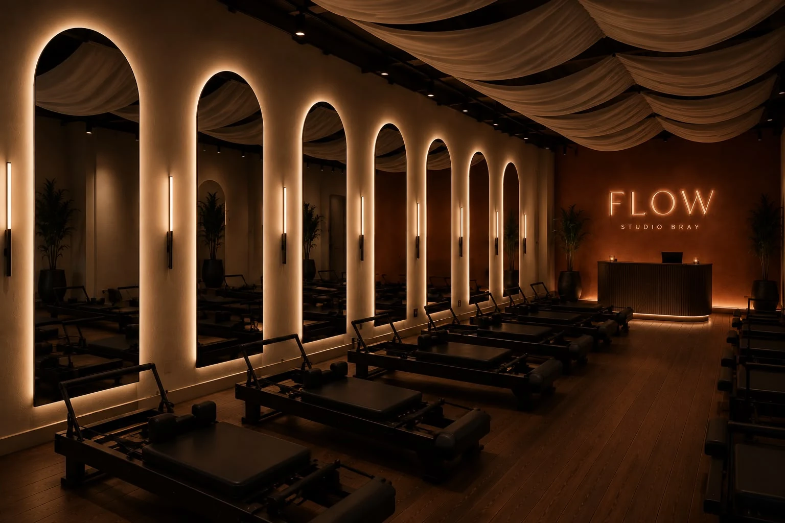 Concept visual: reformer beds beneath backlit arched mirrors, with a glowing Flow sign on a clay wall